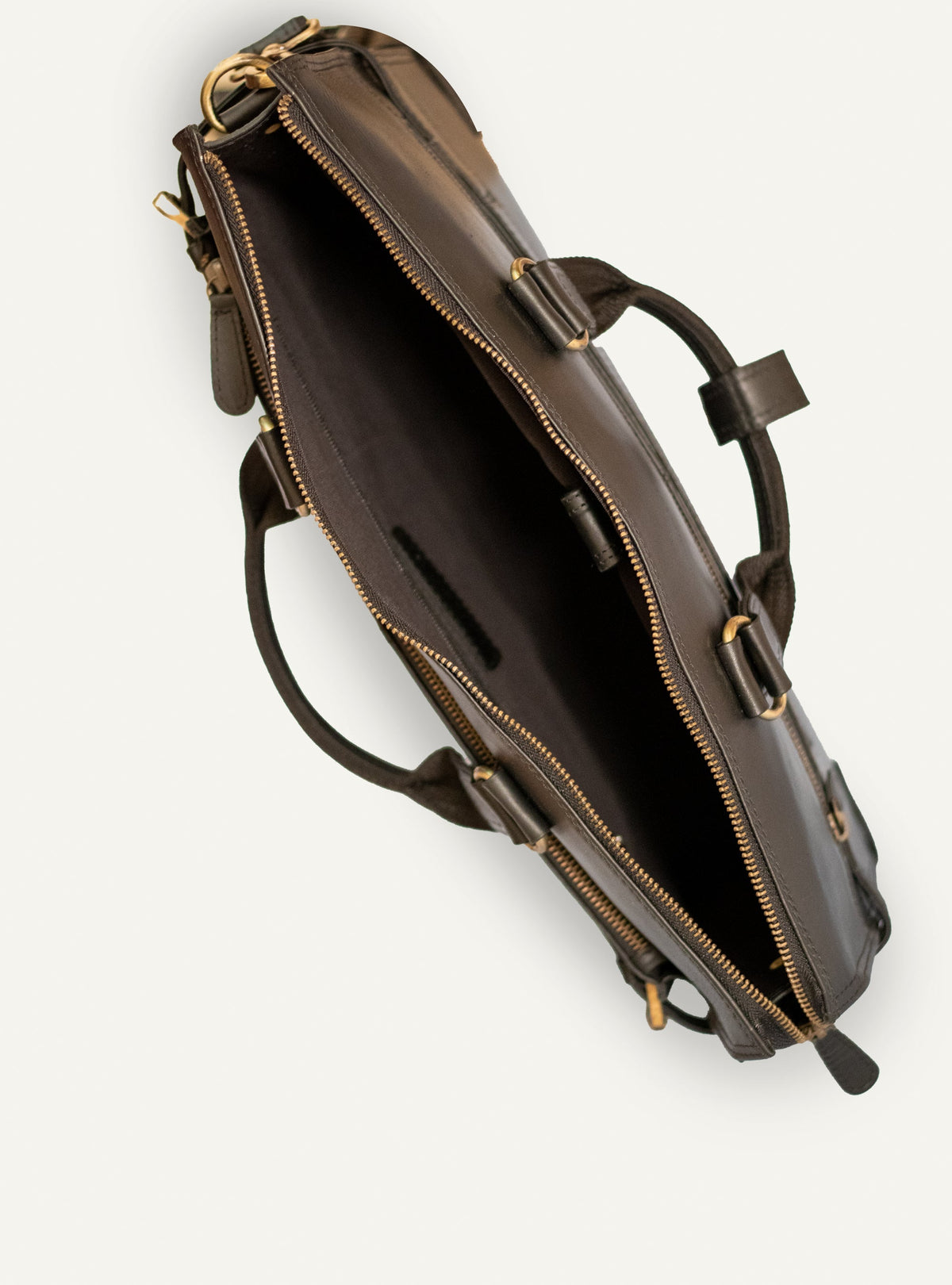 Interior of the black Albert briefcase showing the fabric lining and padded divider