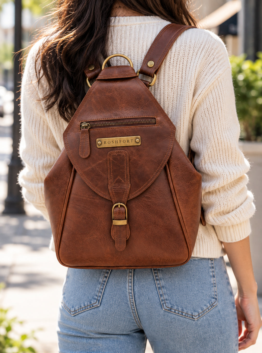 Woman wearing the Mount Tail chestnut as a backpack