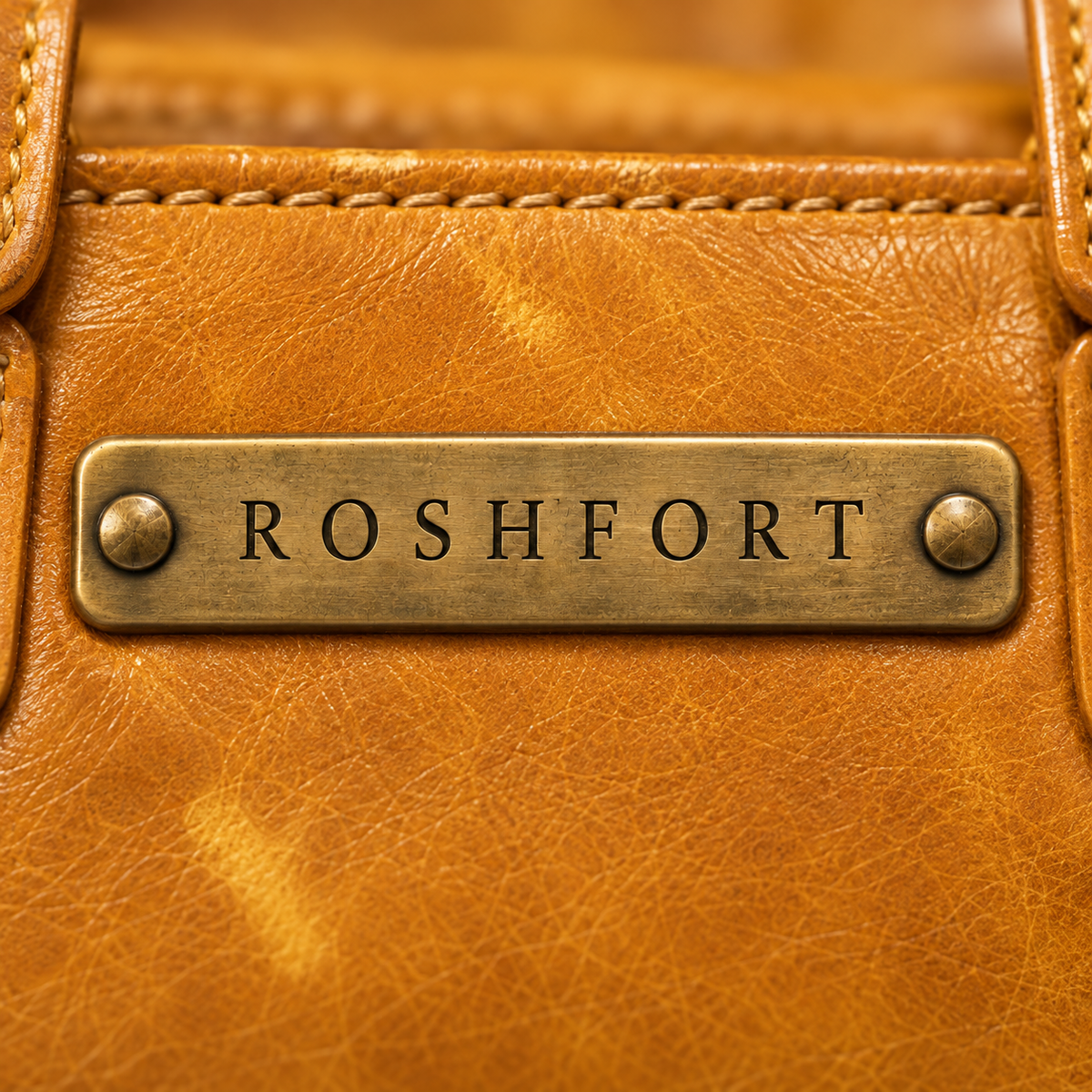 Close-up of the brass plate on the mustard Albert briefcase - this is where your name is engraved