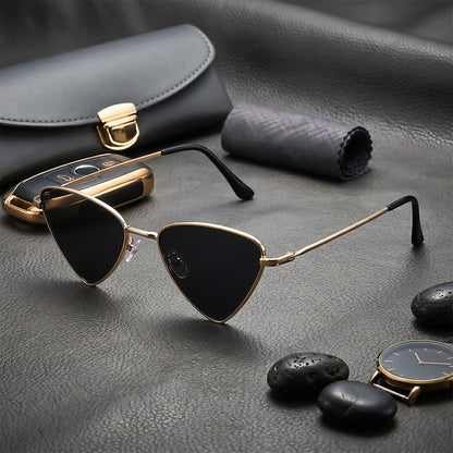 ROSHFORT gold triangular sunglasses on leather with a watch and river stones