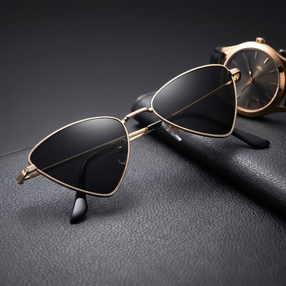 ROSHFORT gold triangular sunglasses styled beside a watch on leather