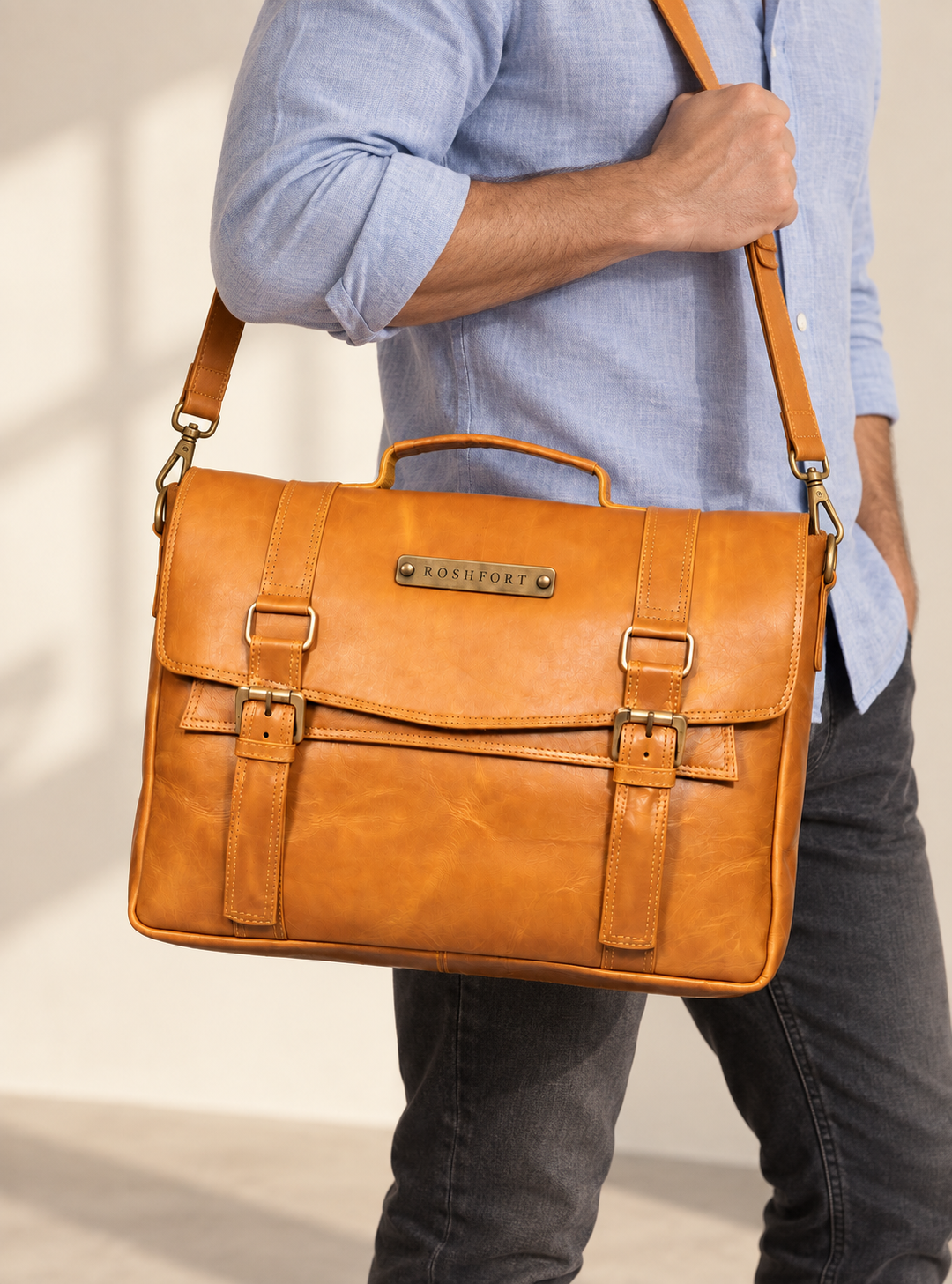 Man carrying the Aldofine tan briefcase on the shoulder strap