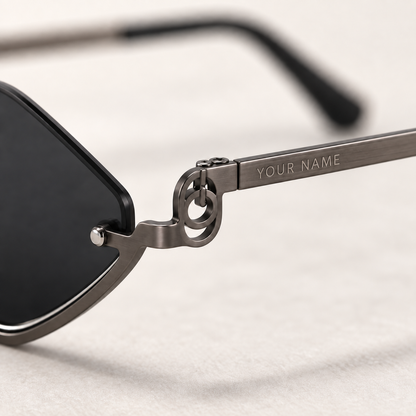 Close-up of your name laser engraved on the temple of the Noir Facet sunglasses