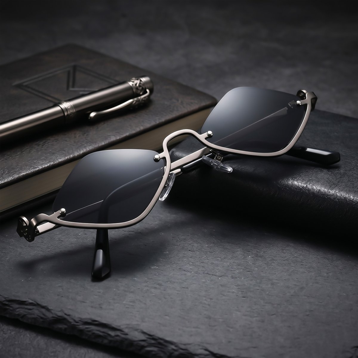 ROSHFORT Noir Facet sunglasses with a notebook and pen