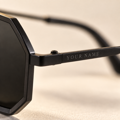 Close-up of your name laser engraved on the temple of the Noir Hexa sunglasses