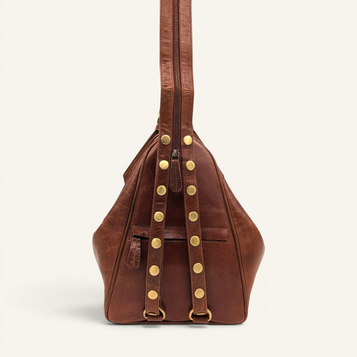 Back of the Mount Tail chestnut with the strap unzipped into two backpack straps
