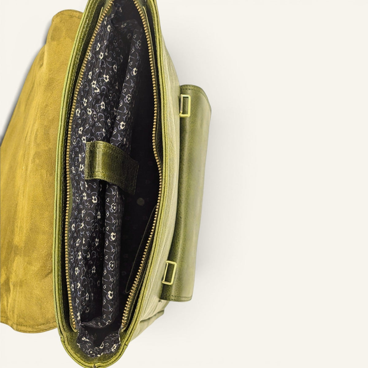 Inside the olive Italic Royal backpack, printed cotton lining and padded panel