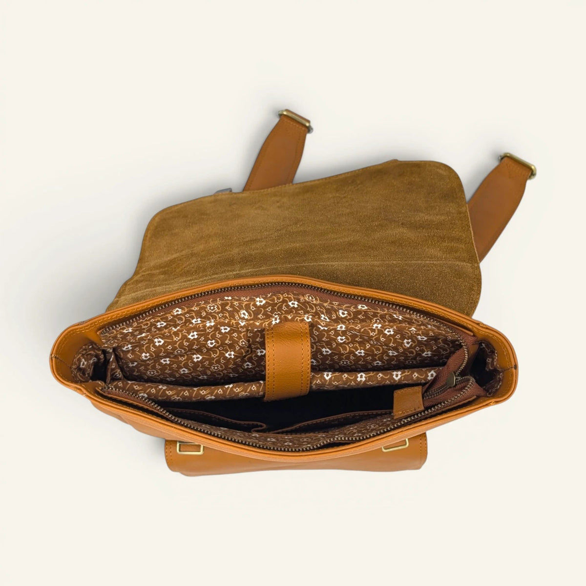Inside the tan Italic Royal backpack, printed cotton lining and padded panel