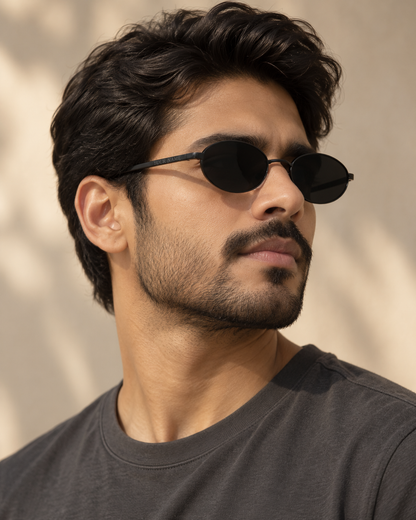 Man wearing ROSHFORT Noir Oval black sunglasses