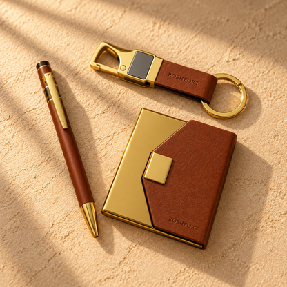 Gold-finish pen, leather keychain and tan card holder
