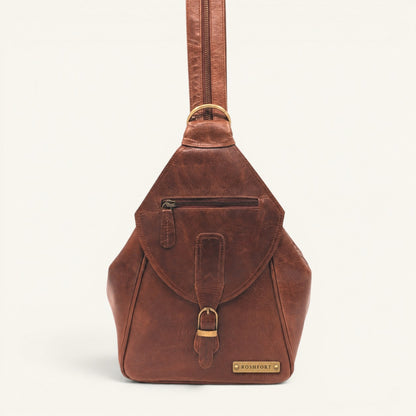 ROSHFORT Activa sling backpack in tan cognac crunch leather, front view with engraved brass name plate