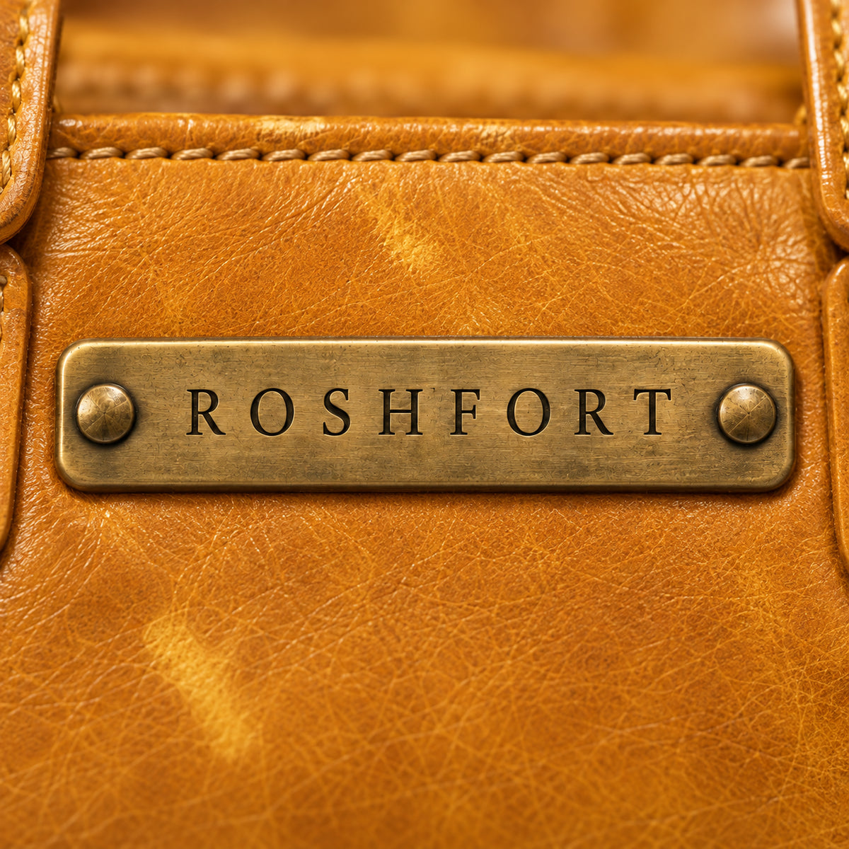 Close-up of the brass plate on the mustard Albert briefcase - this is where your name is engraved