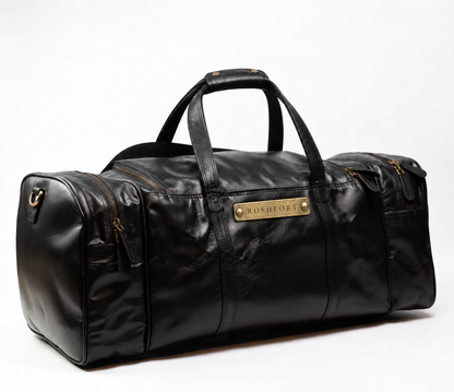 ROSHFORT Amsterdam personalised black leather weekender duffle, three quarter view with engraved brass name plate