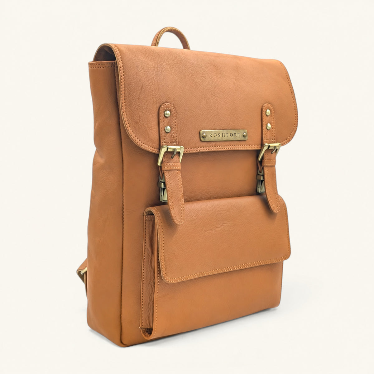 ROSHFORT Italic Royal leather backpack in tan, three quarter view