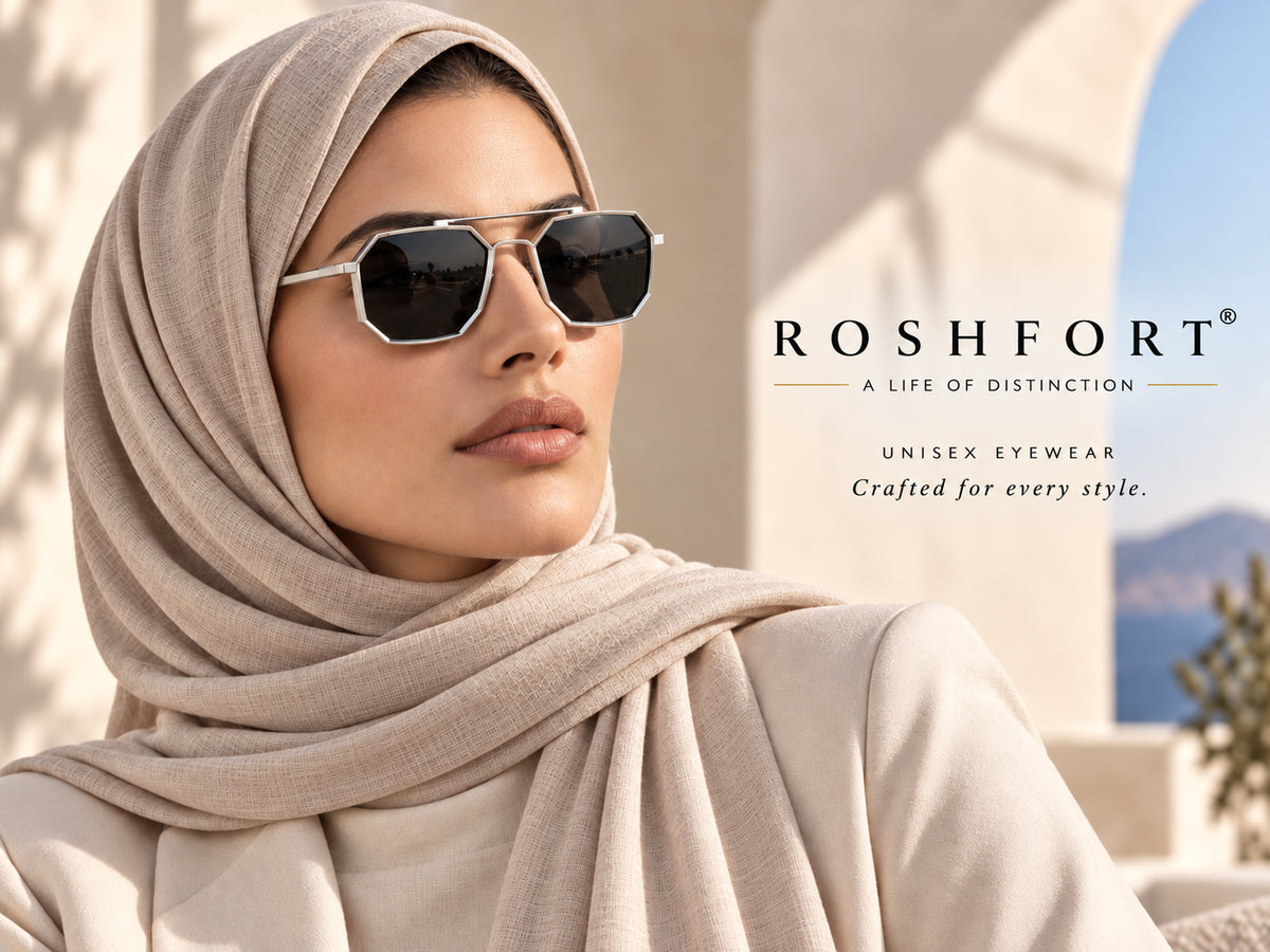 Woman in a beige headscarf wearing silver octagonal sunglasses outdoors.
