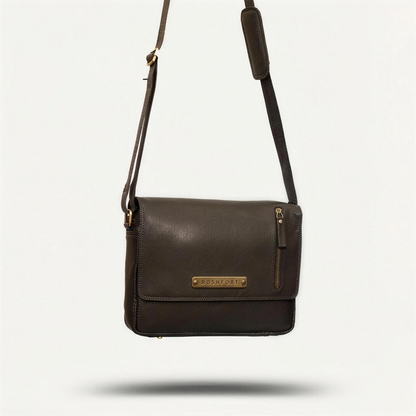 ROSHFORT Vince Cort black leather messenger bag hanging by its strap